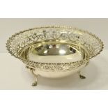A George V silver circular fruit bowl, gadrooned rim and pierced border, cabriole legs, 20.