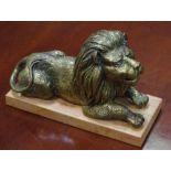 English School (early 19th century), a gilt bronze, of a recumbent lion, rectangular marble base,