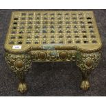 A Victorian brass footman, reticulated top,