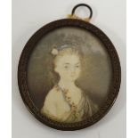 English School, 19th century, a portrait miniature, of a young girl with blue ribbon and flowers,