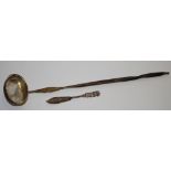 A George III white coloured toddy ladle, wrythen horn handle c.