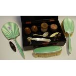 A silver and enamel backed dressing table set comprising clothes & hairbrush and hand mirror,