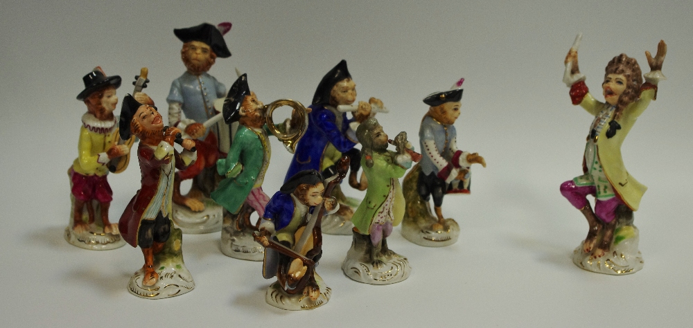 A nine piece Meissen style Monkey band, conductor, Drummer, Bassist, flutist,