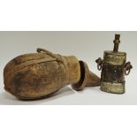 A tribal gourd water vessel and cover; a late 19th/early 20th century Indian powder flask,