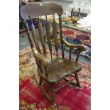 A substantial 20th century oak rocking chair
