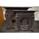 A cast iron fire surround;