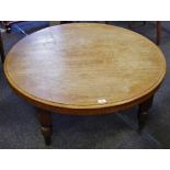 A 20th century mahogany circular coffee table