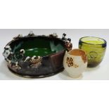 An unusual slip ware fruit bowl with applied Chinese figures peering inward to rim;