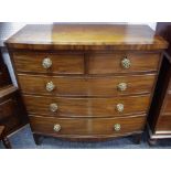 A George III mahogany bowfront chest of two short cockbeaded drawers over three long, c. 1820. 108.