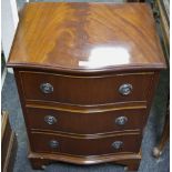 A Regency reproduction small chest, serpentine front, three drawers, ogee feet.