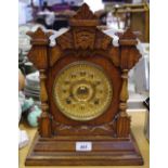 An oak mantel clock, 8 day Tivoli,