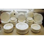 White dinner ware including tureens, two handles soup bowls, dinner plates, dessert plates,