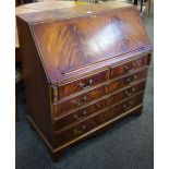 A reproduction mahogany bureau; shaped coffee table,