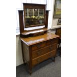 An Art Nouveau oak dressing chest, rectangular mirror,