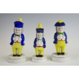 A Staffordshire Porcelainious caster, of a Jolly Toper, wearing a tricorn hat, holding a a mug,