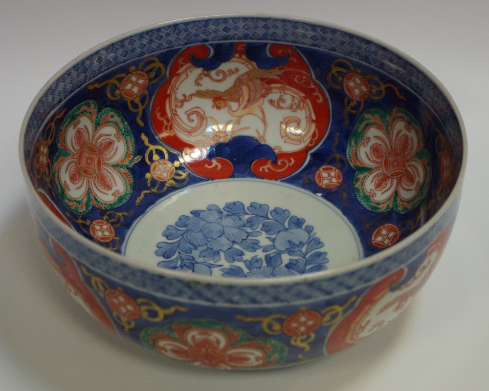 A Japanese Imari bowl, the interior with cobalt blue foliate roundel,