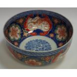 A Japanese Imari bowl, the interior with cobalt blue foliate roundel,