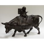 A Chinese bronze boy riding a bull,