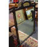 A late Victorian ebonised overmantel. 127cm high x 106cm wide.