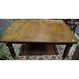 A Victorian mahogany wind out dining table, turned fluted legs,