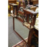 An Edwardian mahogany overmantel mirror, broken swan neck pediment, semi-circular mirror,