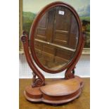 A Victorian mahogany oval dressing table mirror, with hinged compartment, 69cm x 59cm, c.