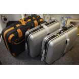 A pair of Antler suitcases;