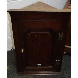 A 19th century oak corner cupboard, of small proportions,