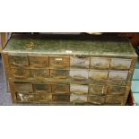 An early 20th century workshop cabinet, twenty four drawers,