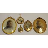 A 9ct gold circular double sided photograph locket; another smaller;