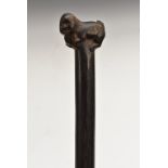 A tribal walking stick, the pommel carved as a stylised baboon, 88cm long,