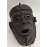 Tribal Art - a Sukuma mask, pronounced elliptical features, hide covered, 40cm long,