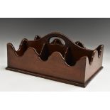 A George III style mahogany butler's wine bottle carrier, arched handle, shaped borders,