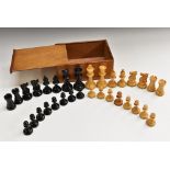 A boxwood and ebonised Staunton pattern chess set, the Kings 8.