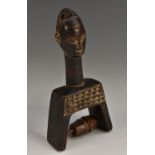 Tribal Art - an African figural heddle pulley, chip-carved with a band of geometric chevrons, 16.