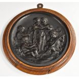 A 19th century French bois durci type composition roundel, of putti allegorical of the Arts,