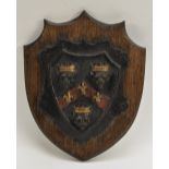 A 19th century cast iron armorial shield, possibly cast with the arms of Guys Hospital,