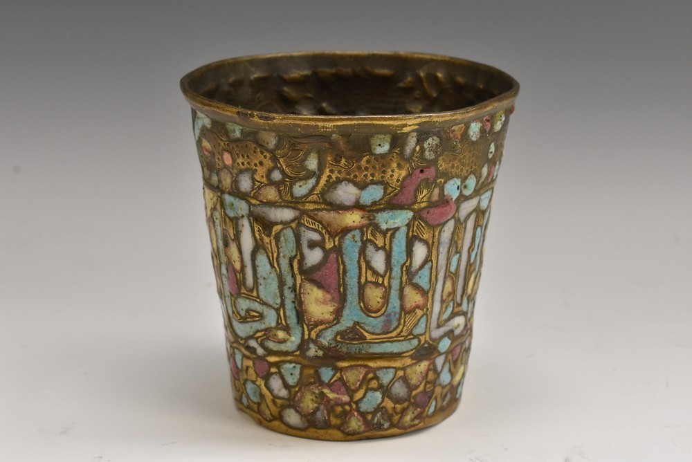 A Middle Eastern gilt copper and enamel tapered cylindrical vessel,