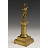 A 19th century French desk bronze, depicting Napoleon Bonaparte, he stands, in iconic pose,