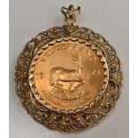 A 1974 Krugerrand pendant, ornate 9ct gold frame, 45.