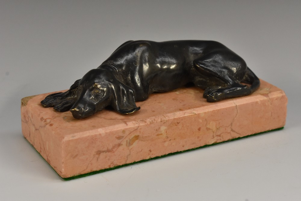 A 19th century bronze desk weight, cast as a dog, rectangular rose marble base,