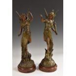 A pair of late 19th century French brown patinated spelter sculptures of La Paix and La Fortune,