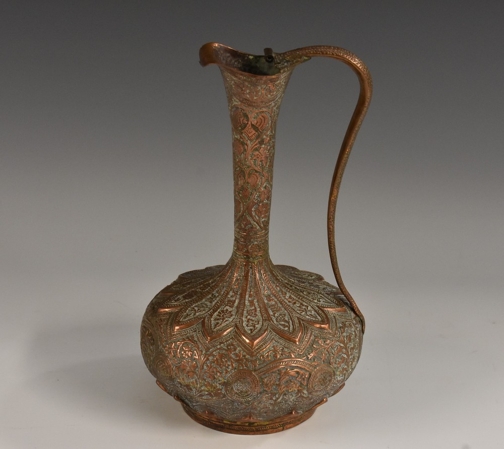 A 19th century Indian Mughal brown patinated bronze ewer,