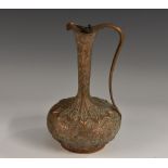 A 19th century Indian Mughal brown patinated bronze ewer,