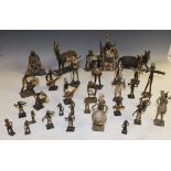 A collection of African painted alloy figures, depicting tribal characters and native animals,