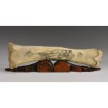 A bone 'scrimshaw', decorated with a sailor looking out to sea and inscribed Salem 1872,