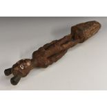 Tribal Art - an African peg or finial, carved as a figure, decorated with earth pigments,