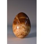 A 19th century fluorspar egg shaped paperweight, turned and polished,