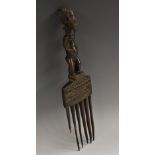 Tribal Art - a Luba comb, figural handle, chip-carved geometric frieze, 29cm long,