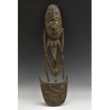 Tribal Art - a Papua New Guinea ceremonial food hook, carved as a stylised figure,